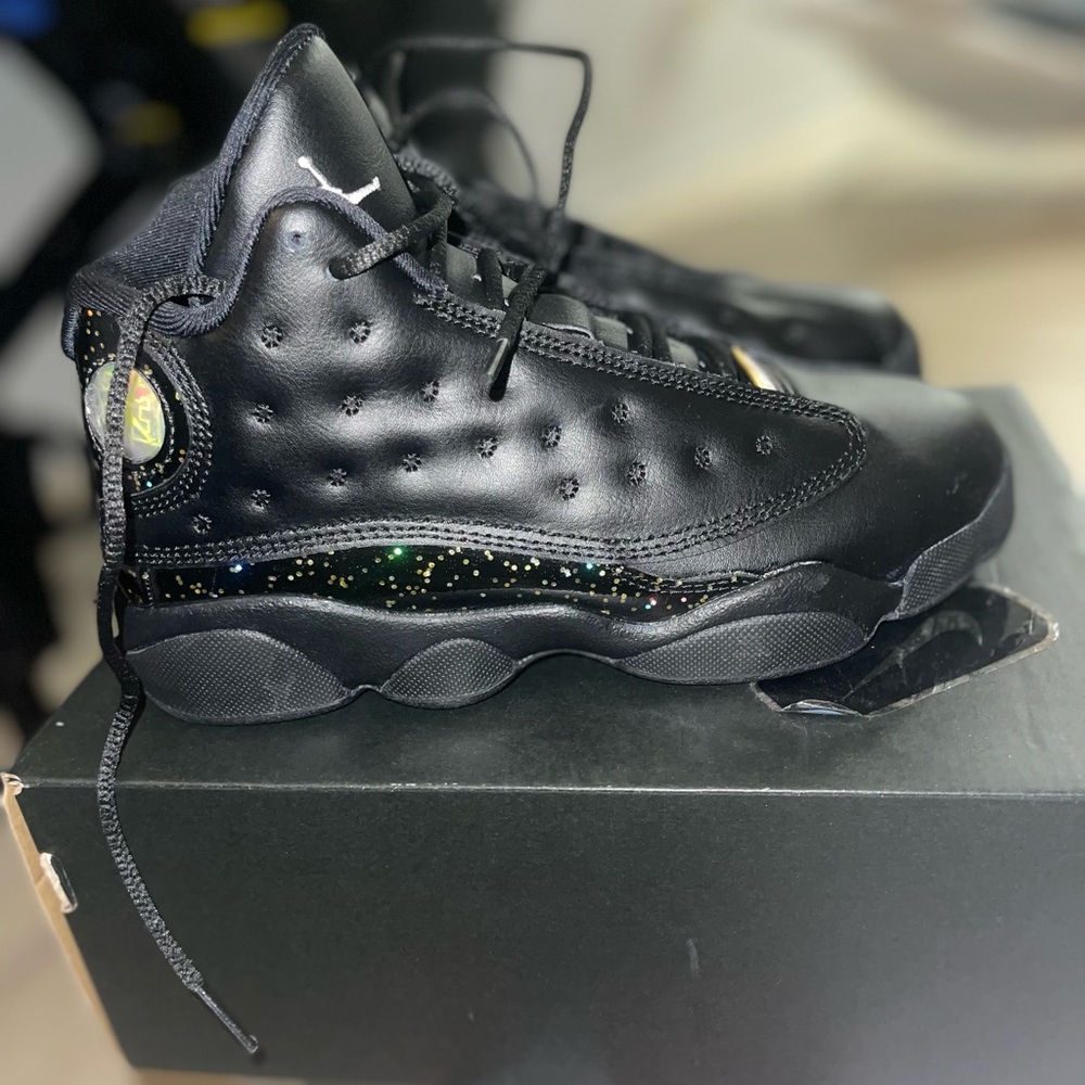 Brand new Jordan 13s black/metallic gold . pre school size 3